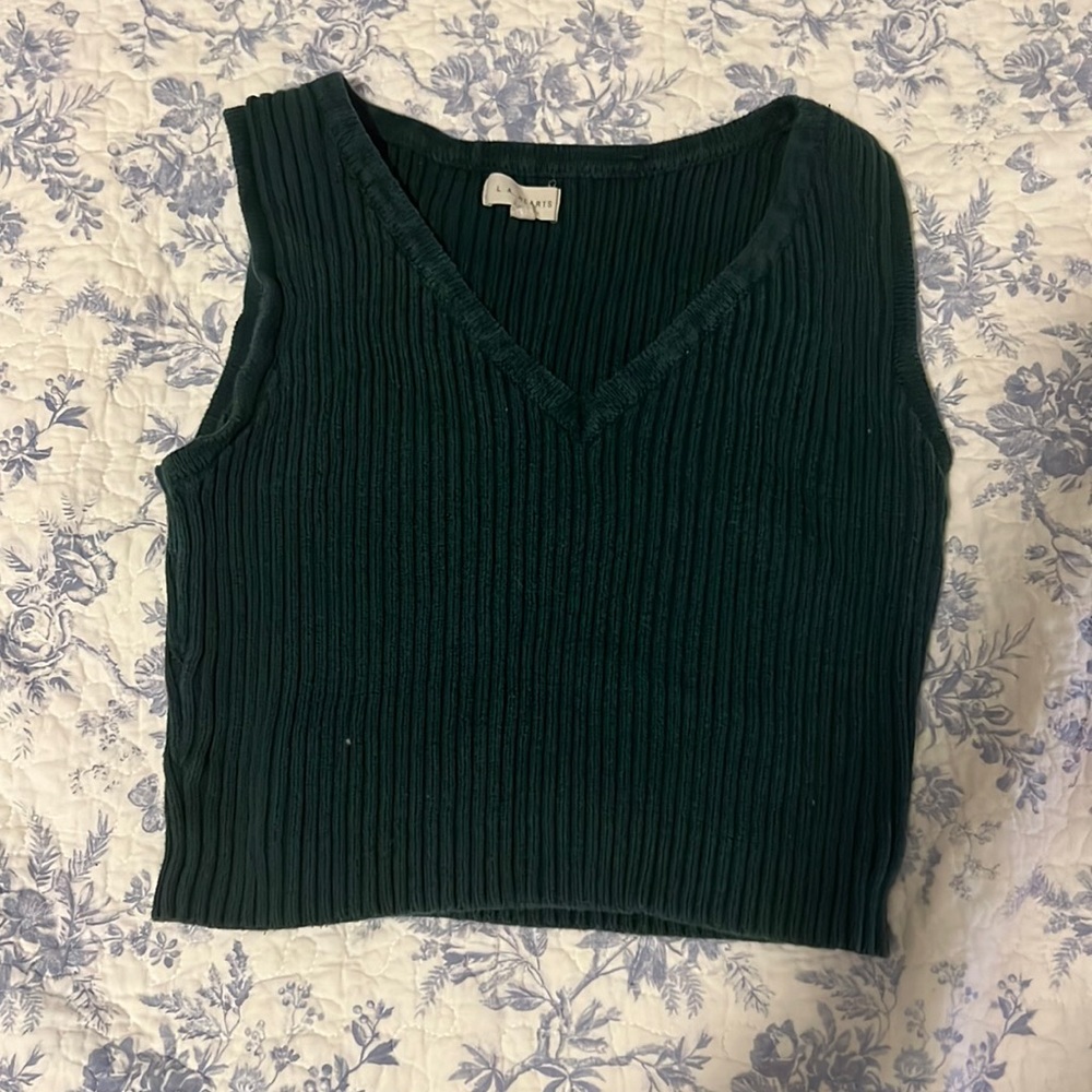 Green sweater vest.